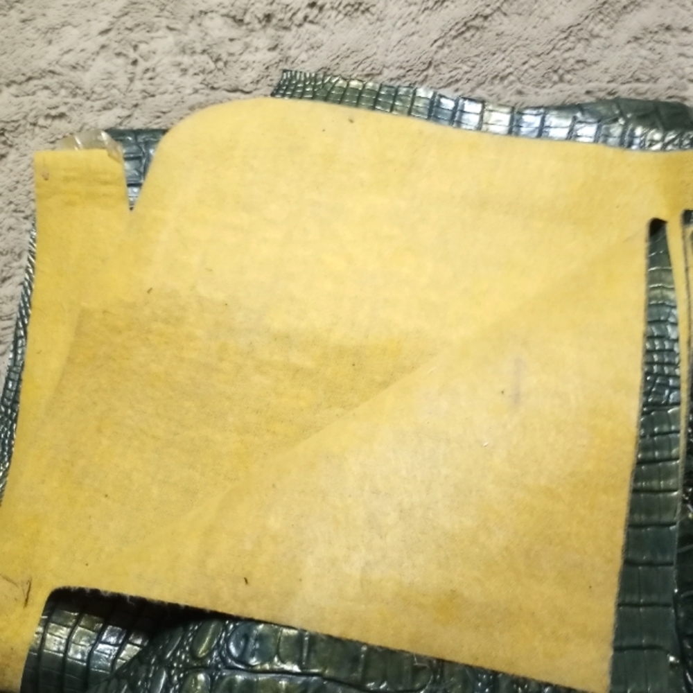 Faux alligator material green with gold iridescent